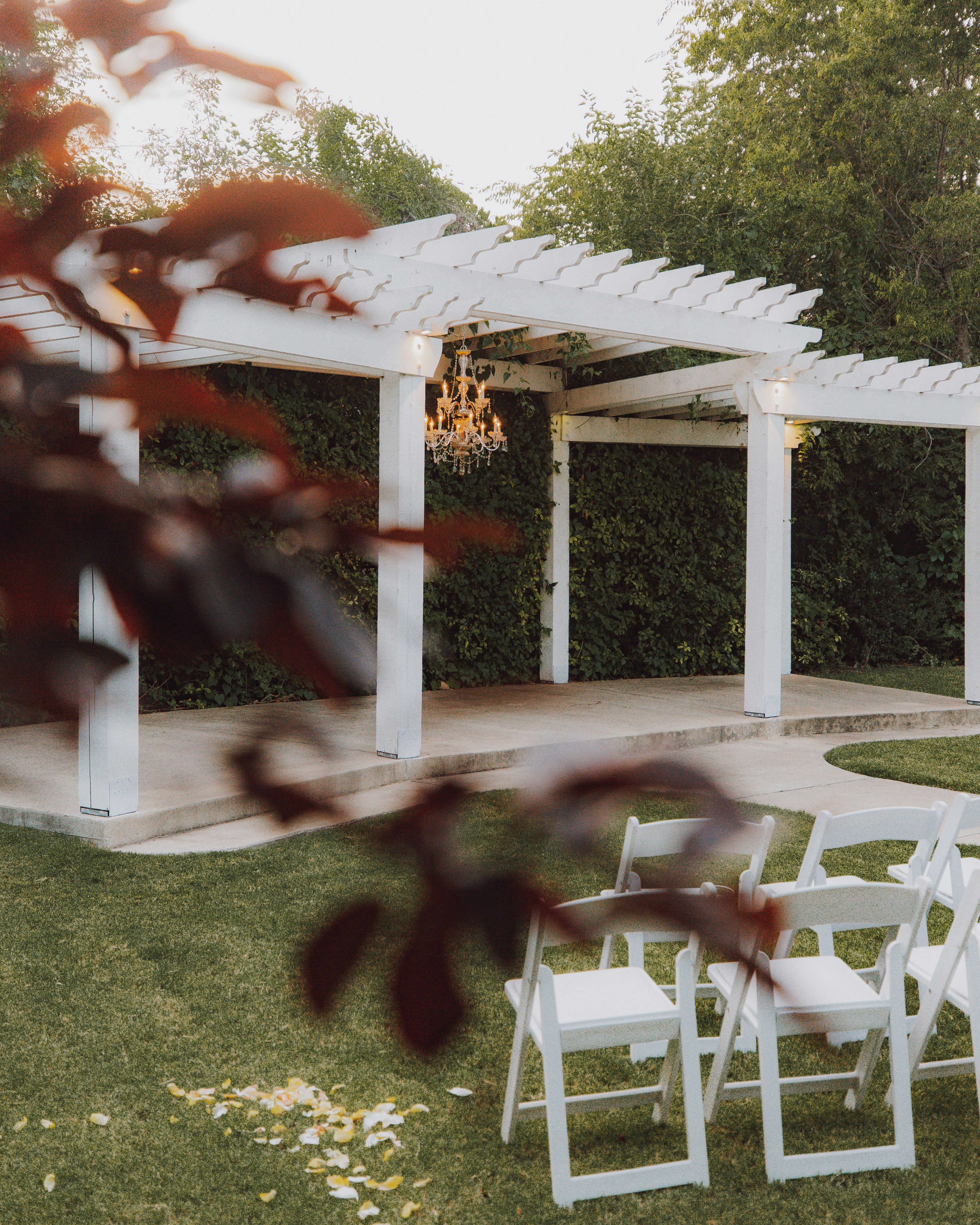 white wooden gazebo near green grass field during daytime